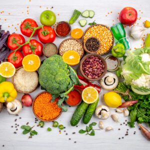 A table topped with lots of different fruits and vegetables.